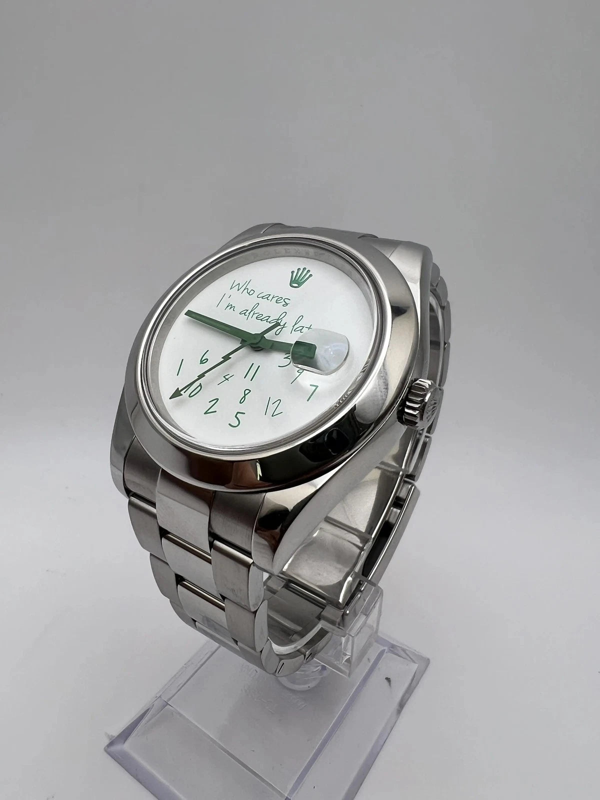Rolex customized version featuring a white dial with the phrase "Who Cares I'm Already Late" and scattered numerals Milgauss featuring a white dial with the phrase "Who Cares I'm Already Late" and scattered numerals