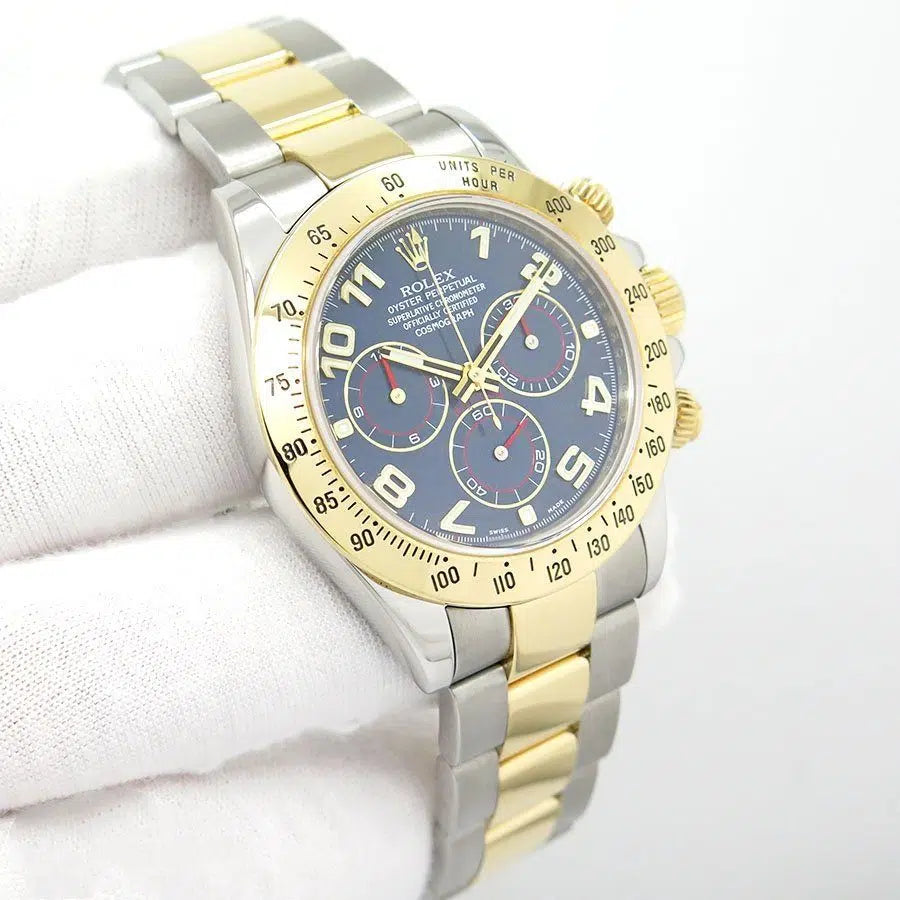 Rolex  Daytona featuring a two-tone stainless steel and yellow gold finish with a distinctive blue dial