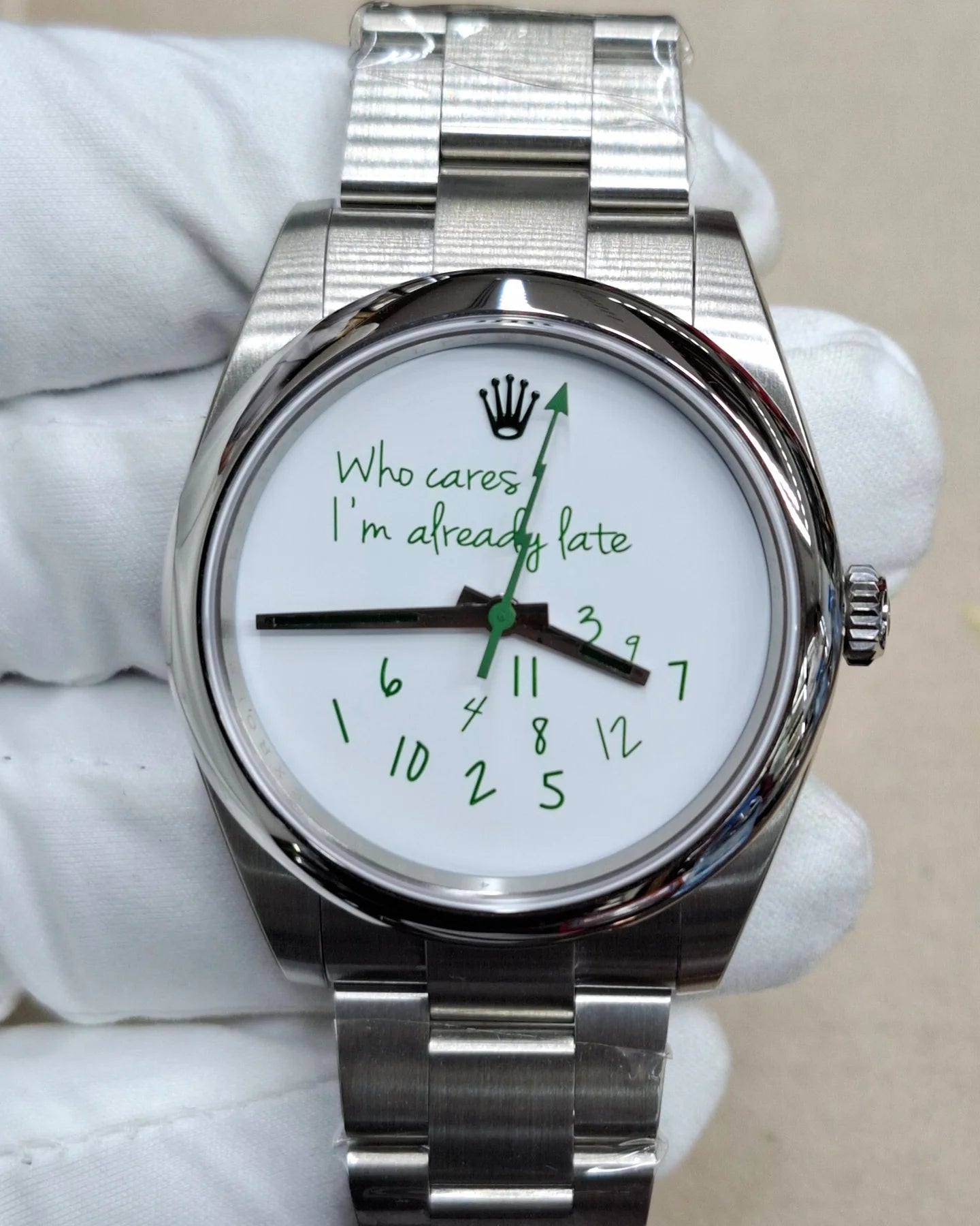 Rolex customized version featuring a white dial with the phrase "Who Cares I'm Already Late" and scattered numerals Milgauss featuring a white dial with the phrase "Who Cares I'm Already Late" and scattered numerals