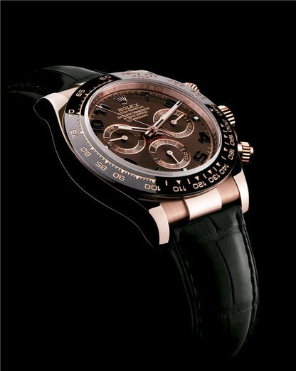 Rolex  Daytona model 116515LN featuring a Rose gold case, a chocolate dial , a black bezel, and a black leather strap.